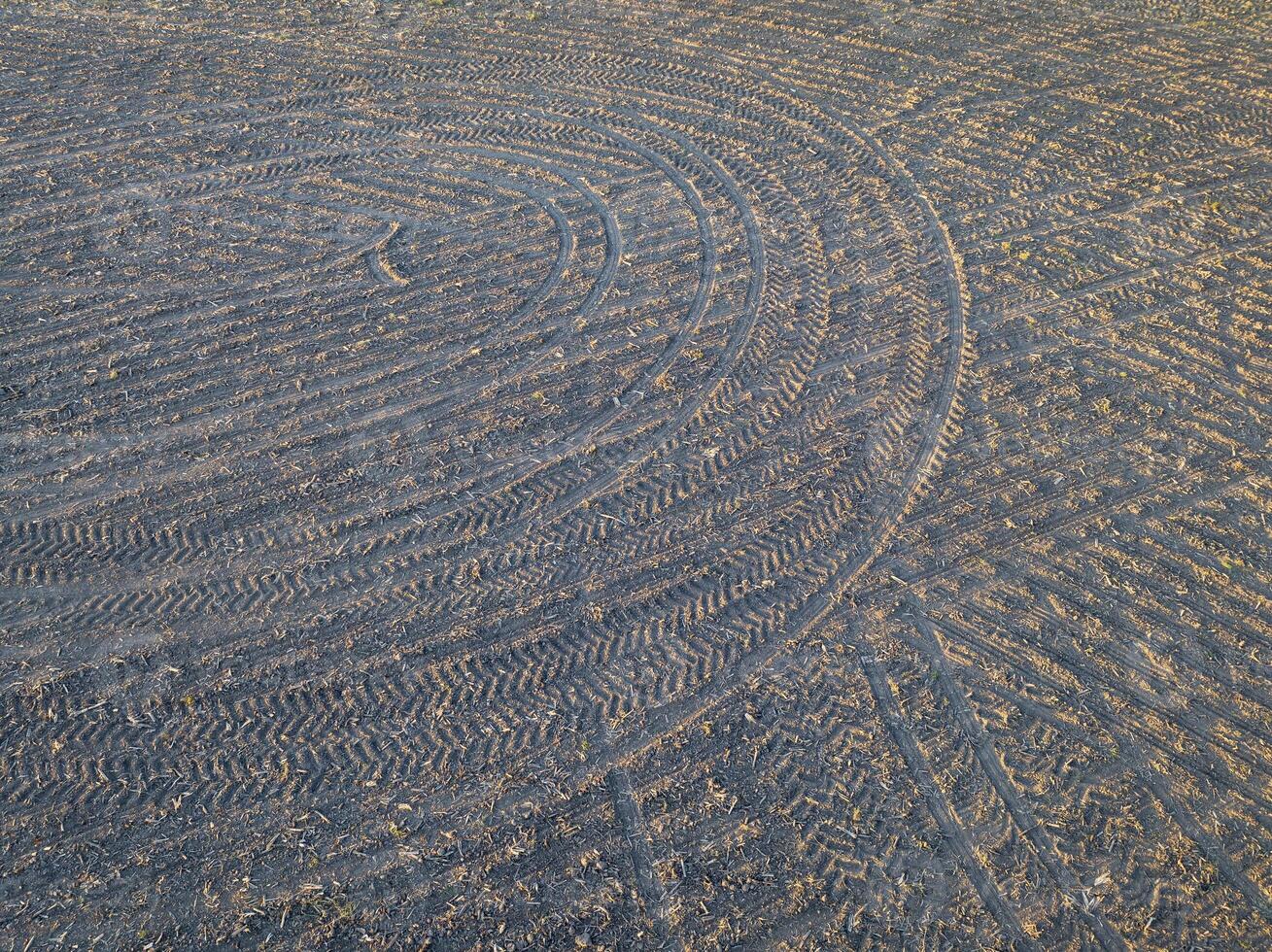 springtime aerial view of plowed corn fields with tractor footprints in central Missouri photo