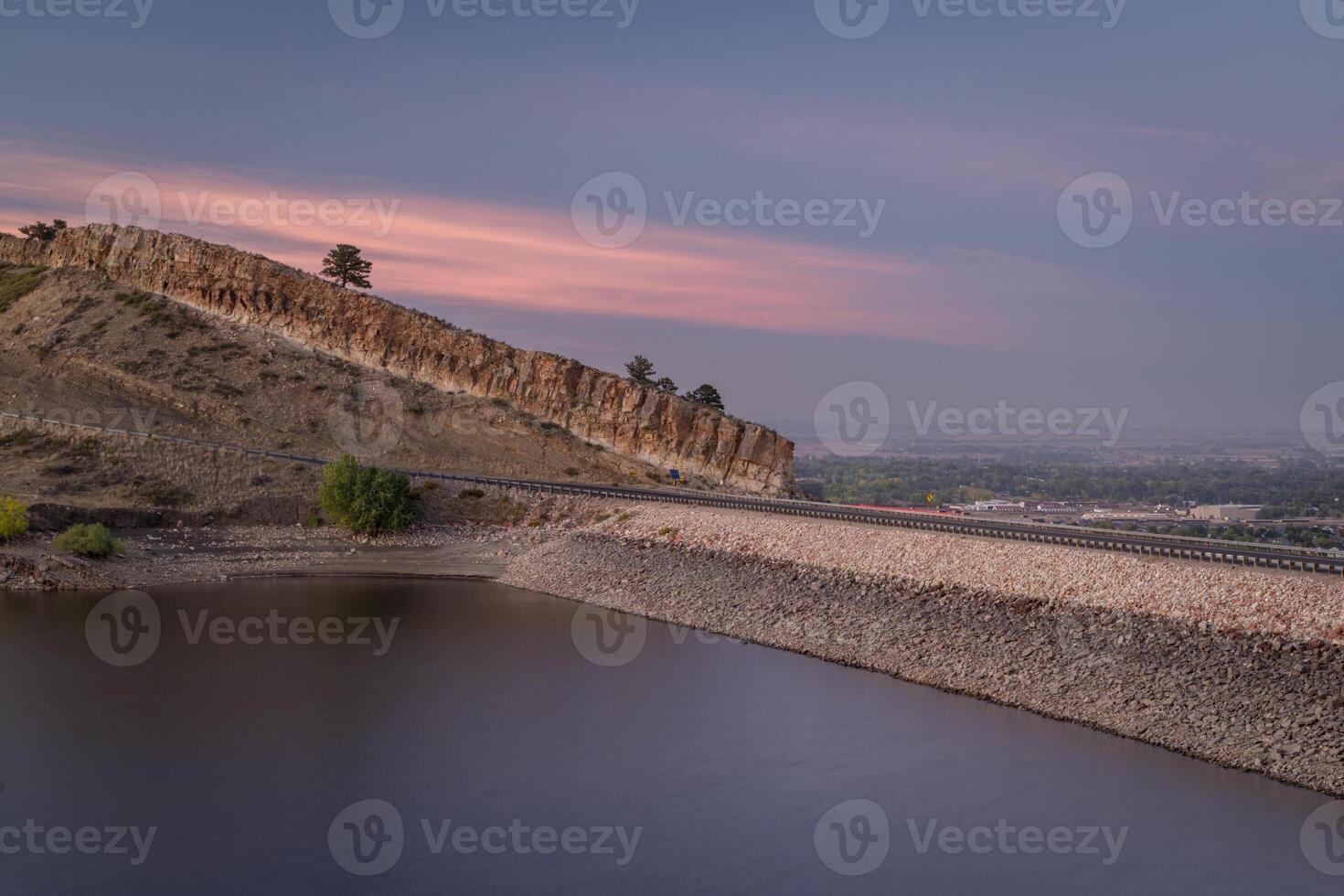 dusk over calm waters of Horsetooth Reservoir at foothills of Rocky Mountains in Colorado photo