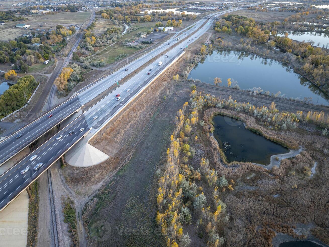 aerial view of Colorado landscape near Fort Collins with evening traffic on I-25 interstate highway photo