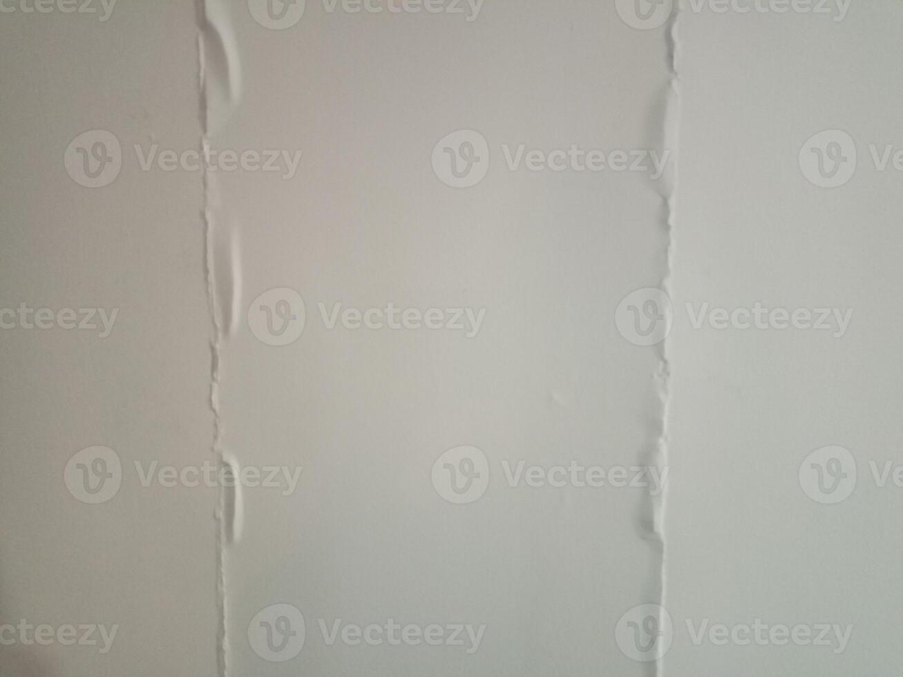 A white wall background with a crack in it photo