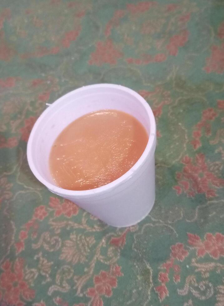 A Hot Cup of Tea Set Gracefully on the Table photo