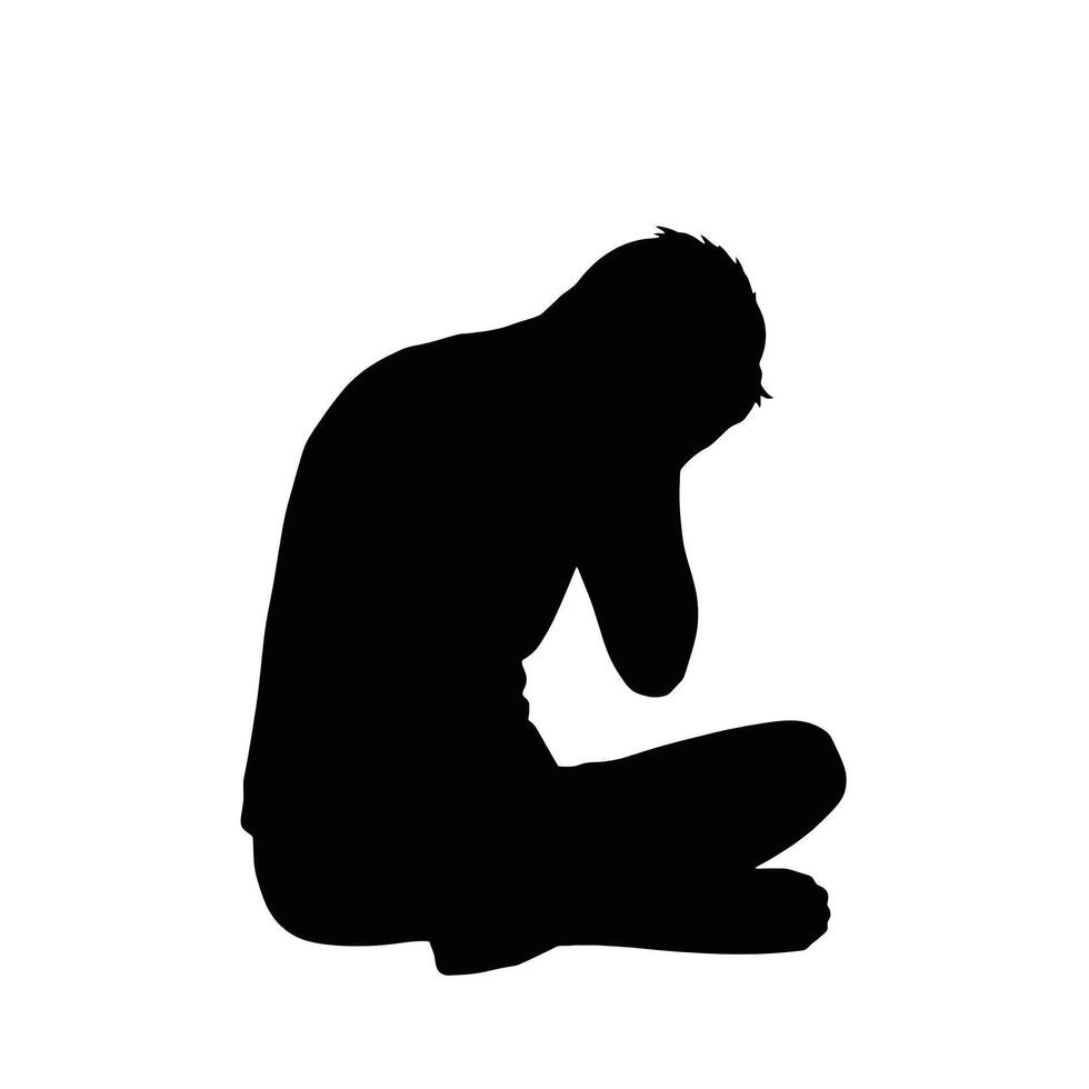 A silhouette of a man sitting down with his head in his hands vector