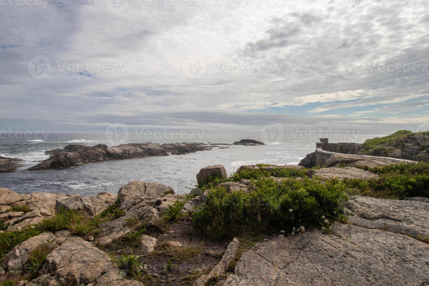 View from a cliff of the Atlantic Ocean on a cloudy day photo