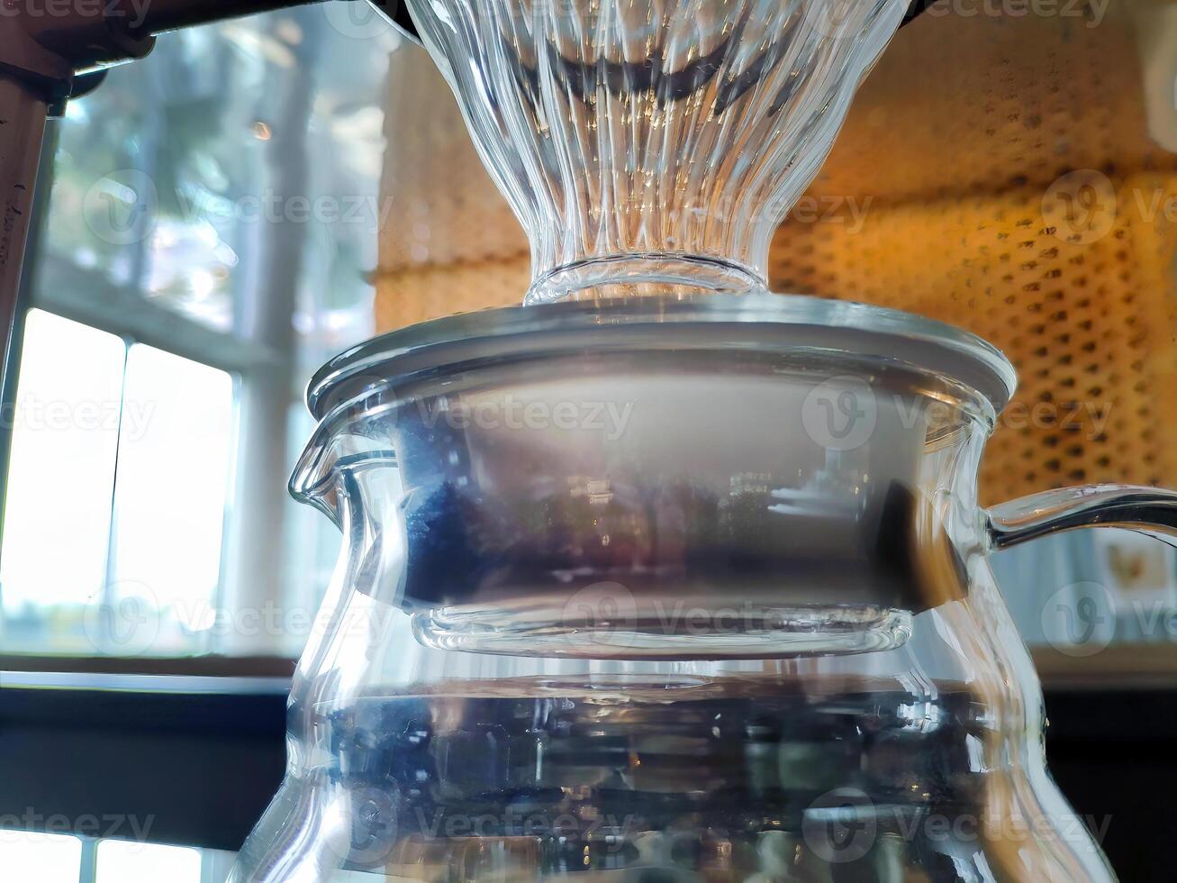 Set of pourover coffee server including heat resistant glass dripper mug, reusable filters or clever dripper, and wooden stand bracket holder, hand drip machine photo