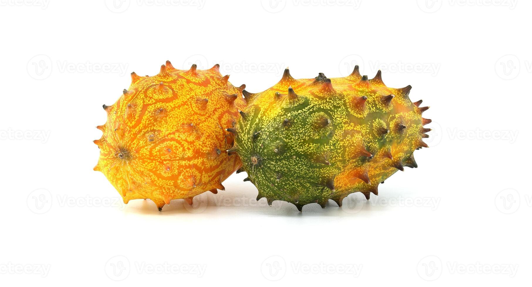 Close-Up Of Ripe and Unripe Horned Melons On White Background photo