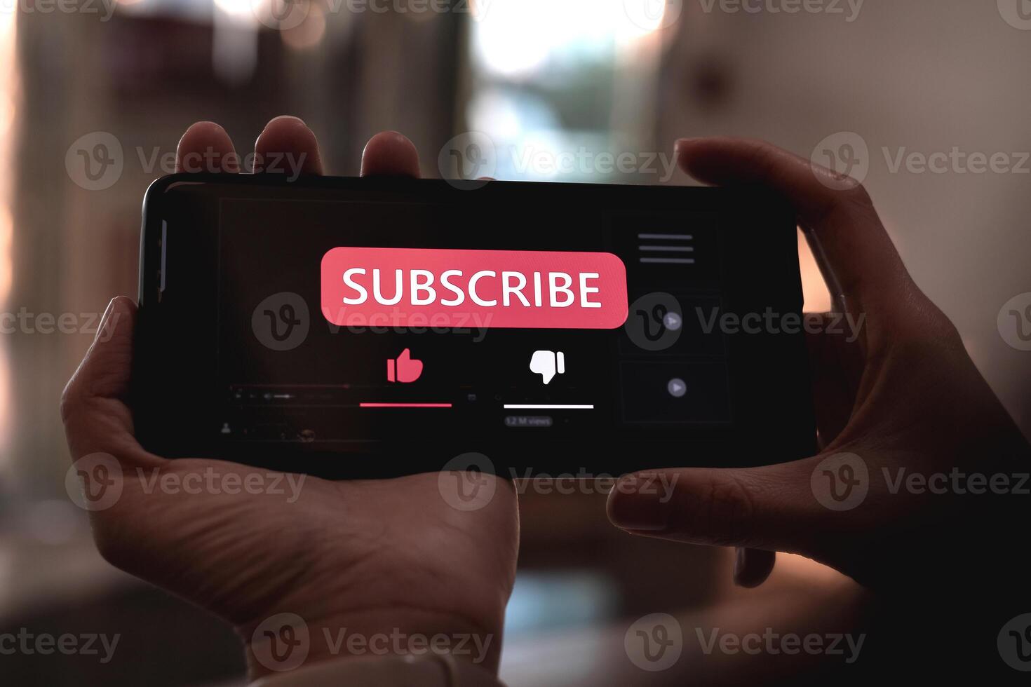 Close-up view of a woman using a smartphone to press red subscribe button on online media. Concepts of technology and following news, hot trends and new content on social media photo