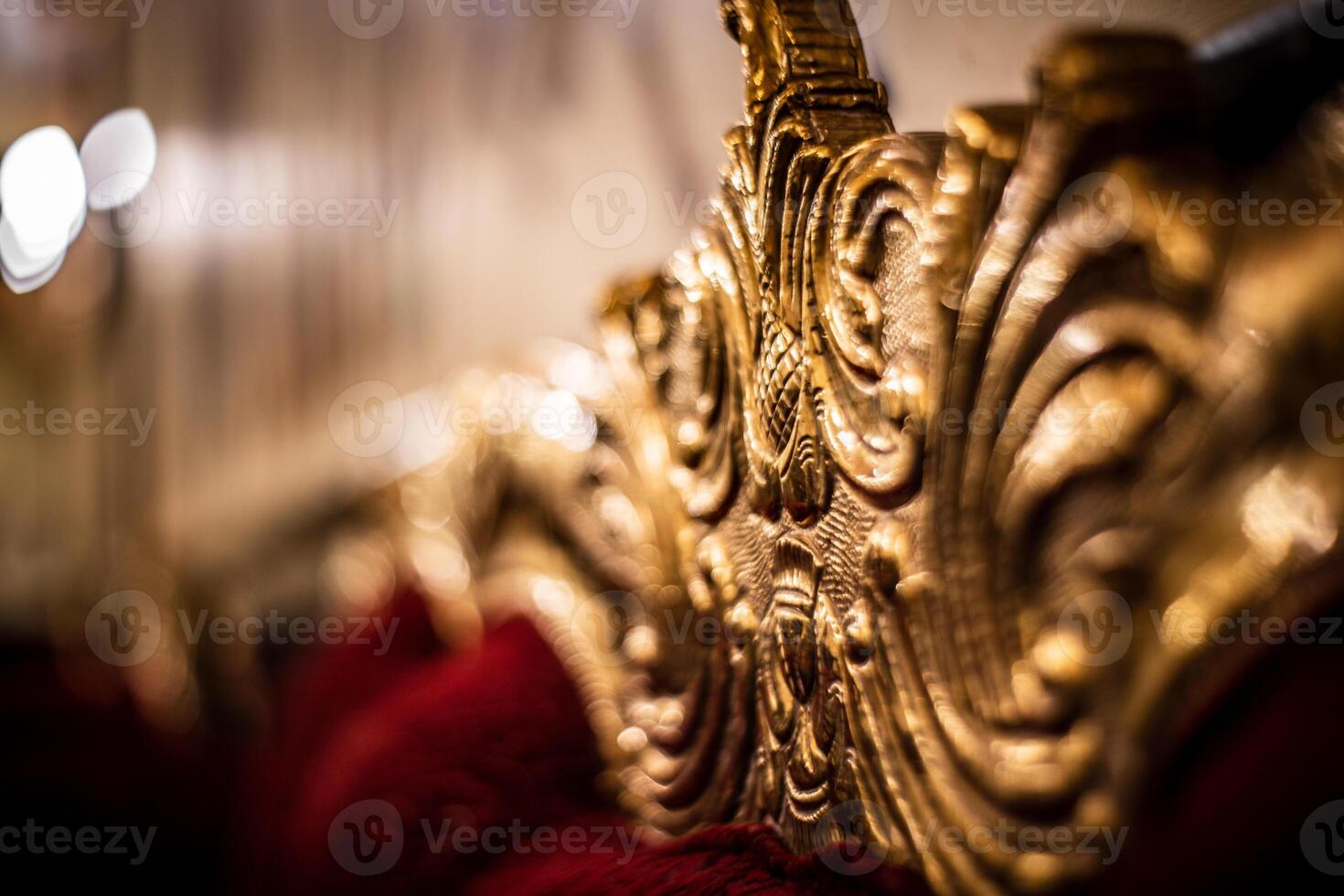 A close up of a gold and red couch photo