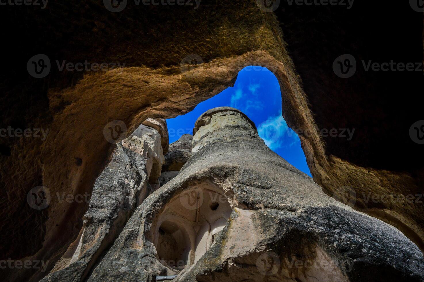 The view from inside a cave in the rock formation photo