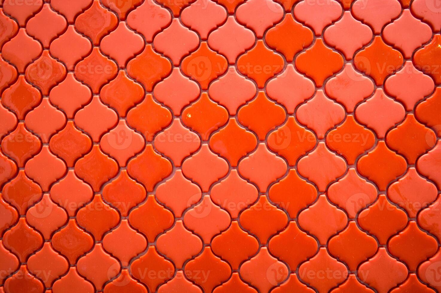 Orange tile background with a pattern of squares photo
