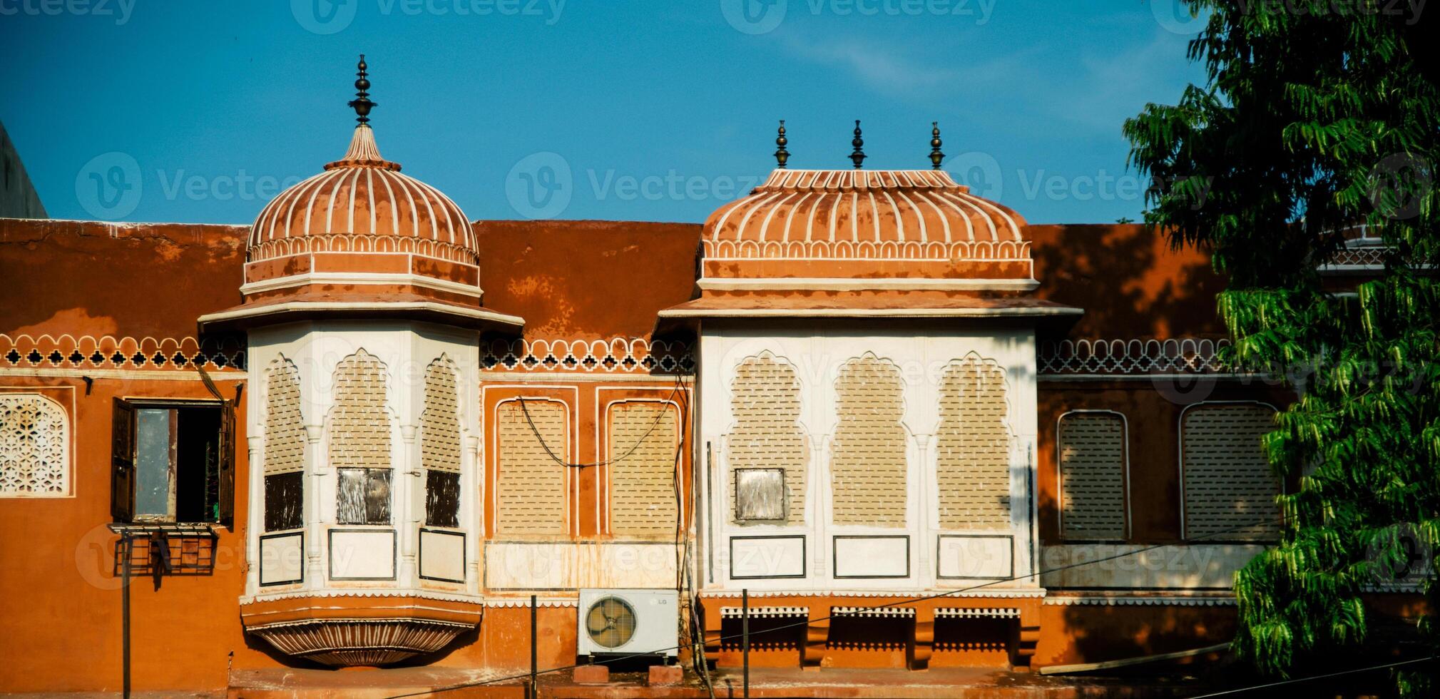 A building with many windows and a clock on top photo