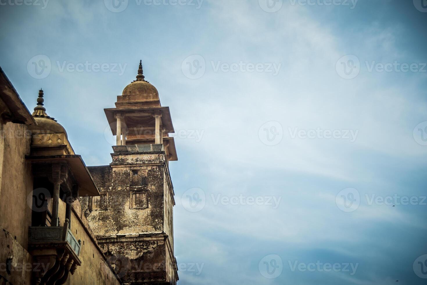 A view of the top of a building with a clock tower photo