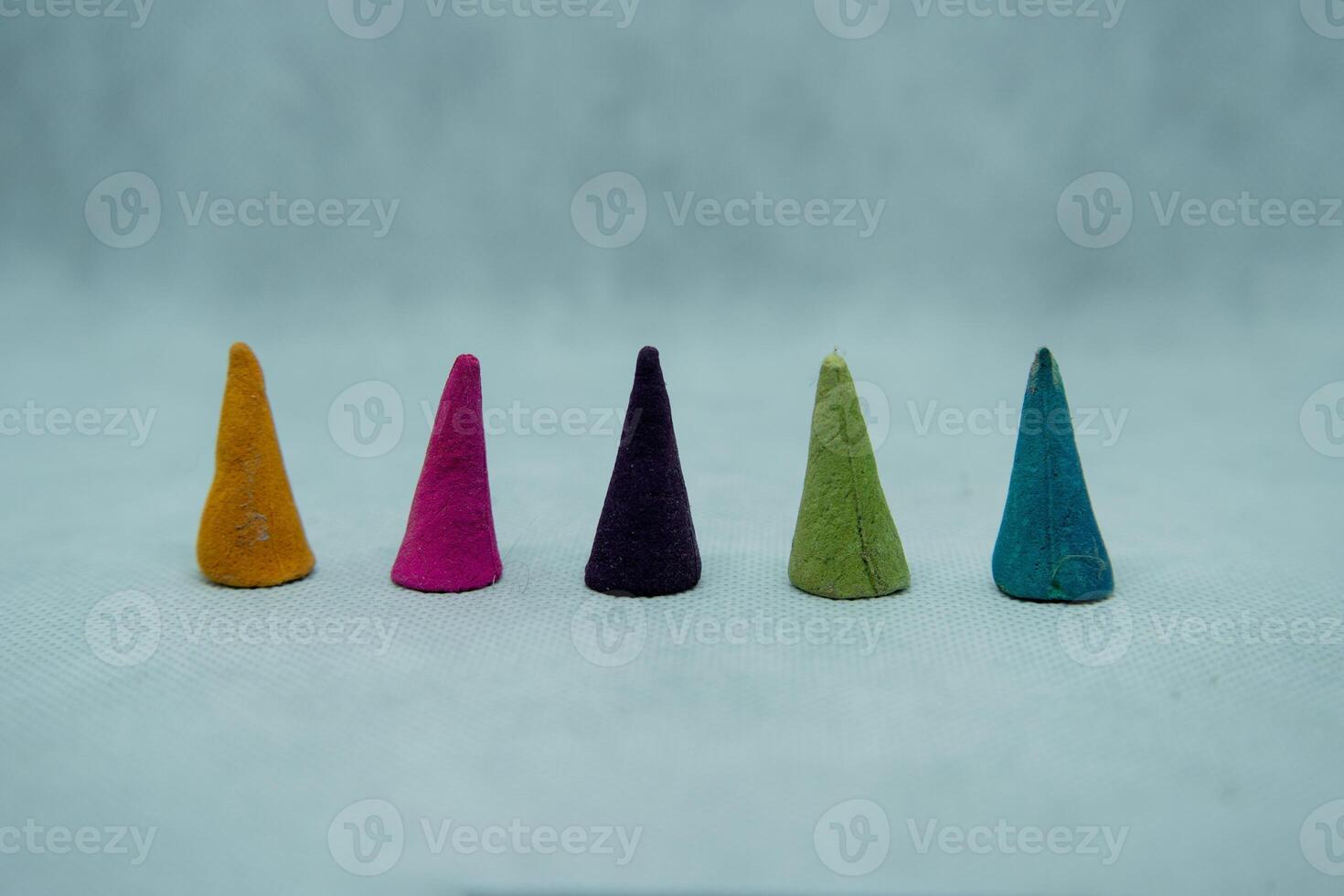 A group of five cones in different colors photo