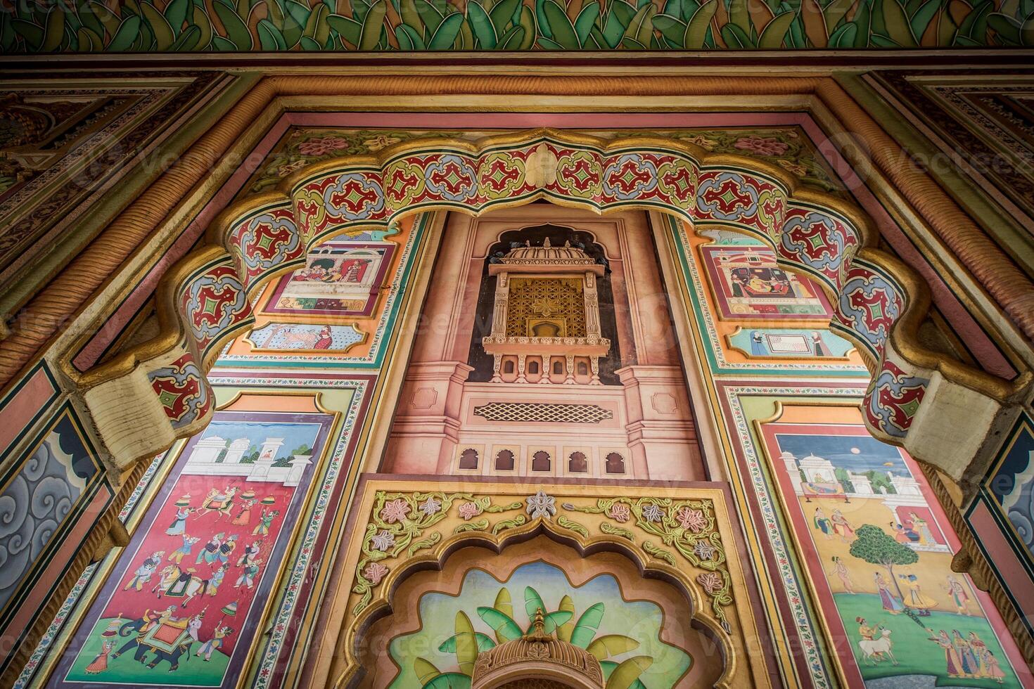 The colorful wall of a building with intricate designs photo
