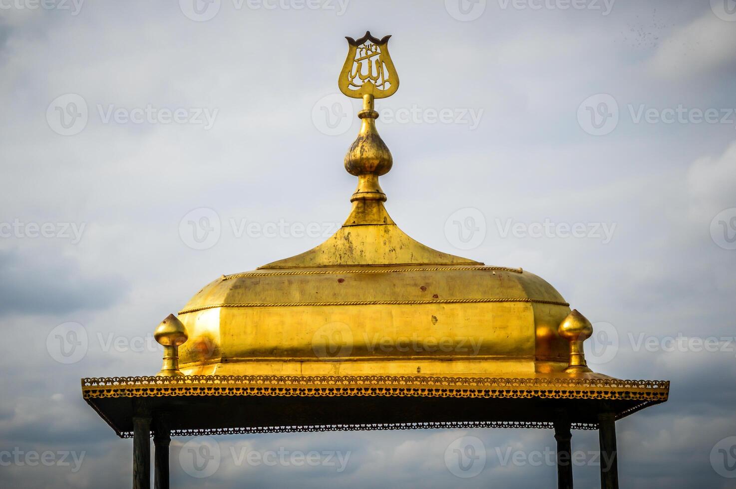 A golden dome with a cross on top photo