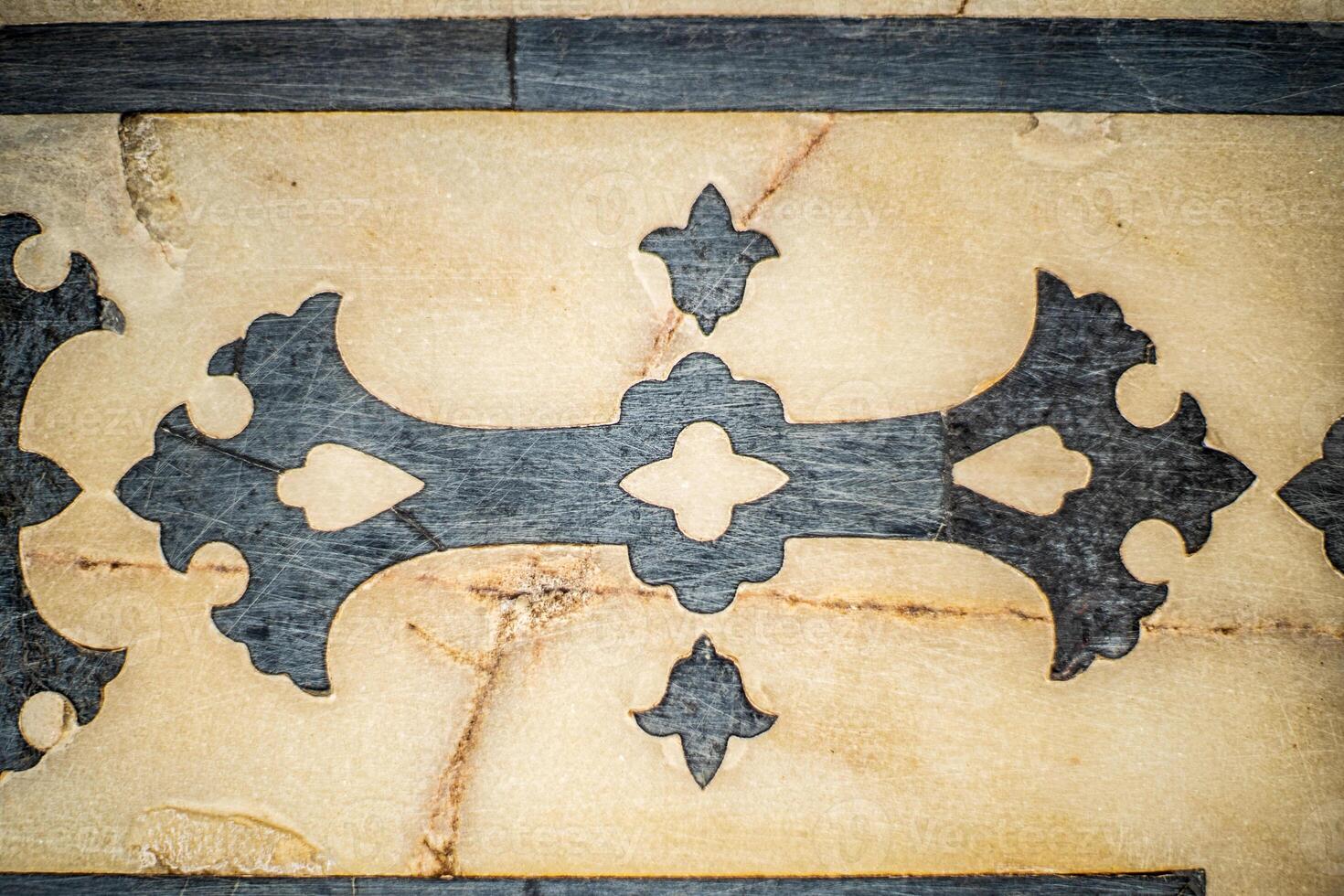 A close up of a decorative pattern on a wall photo