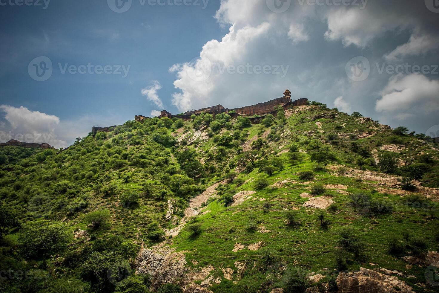 A view of the top of a mountain with a castle on top photo