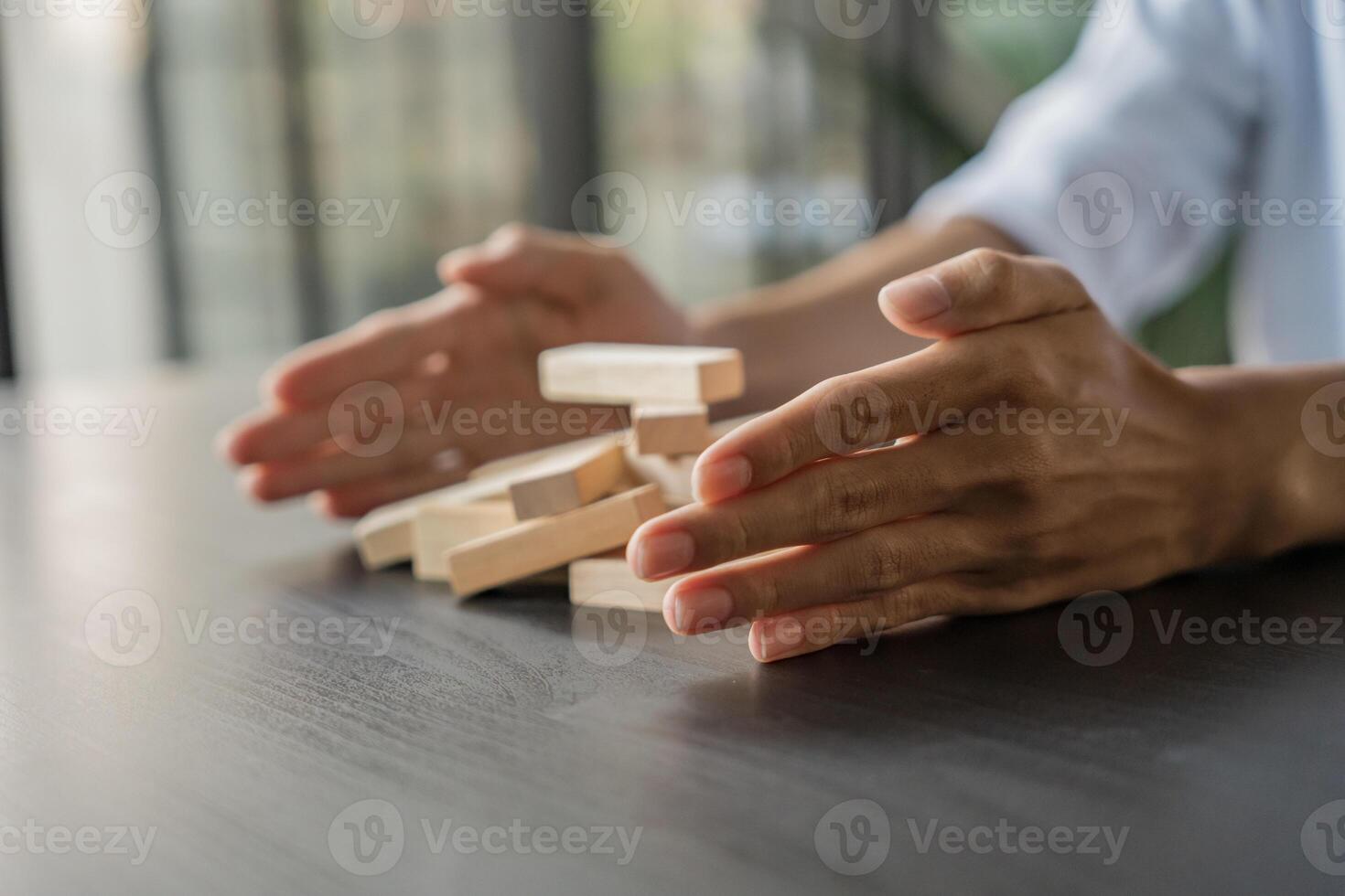 Planning risk and strategy in businessman gambling placing wooden block.Business concept for growth success process. photo