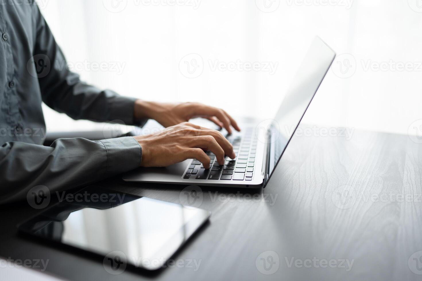 Business man working with laptop Hands typing keyboard. Professional investor working new start up project. business planning in office. Technology business.. photo