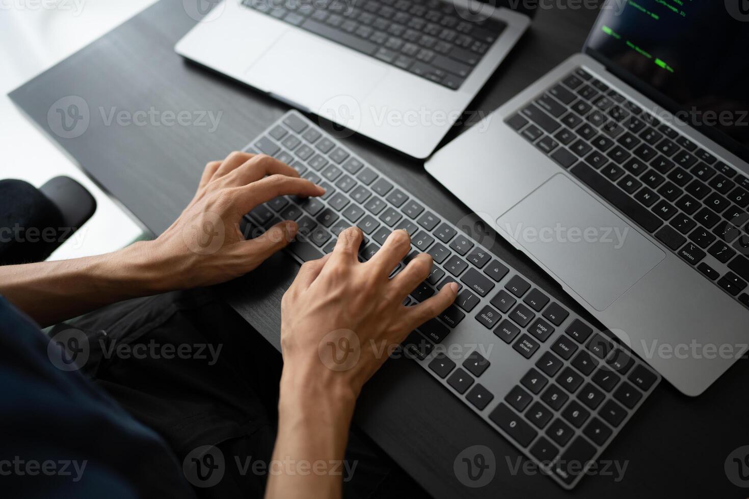 Asian man software engineer Working on Computer at office desk for writing program code IT Software Engineer finding errors tech support devops creating digital photo