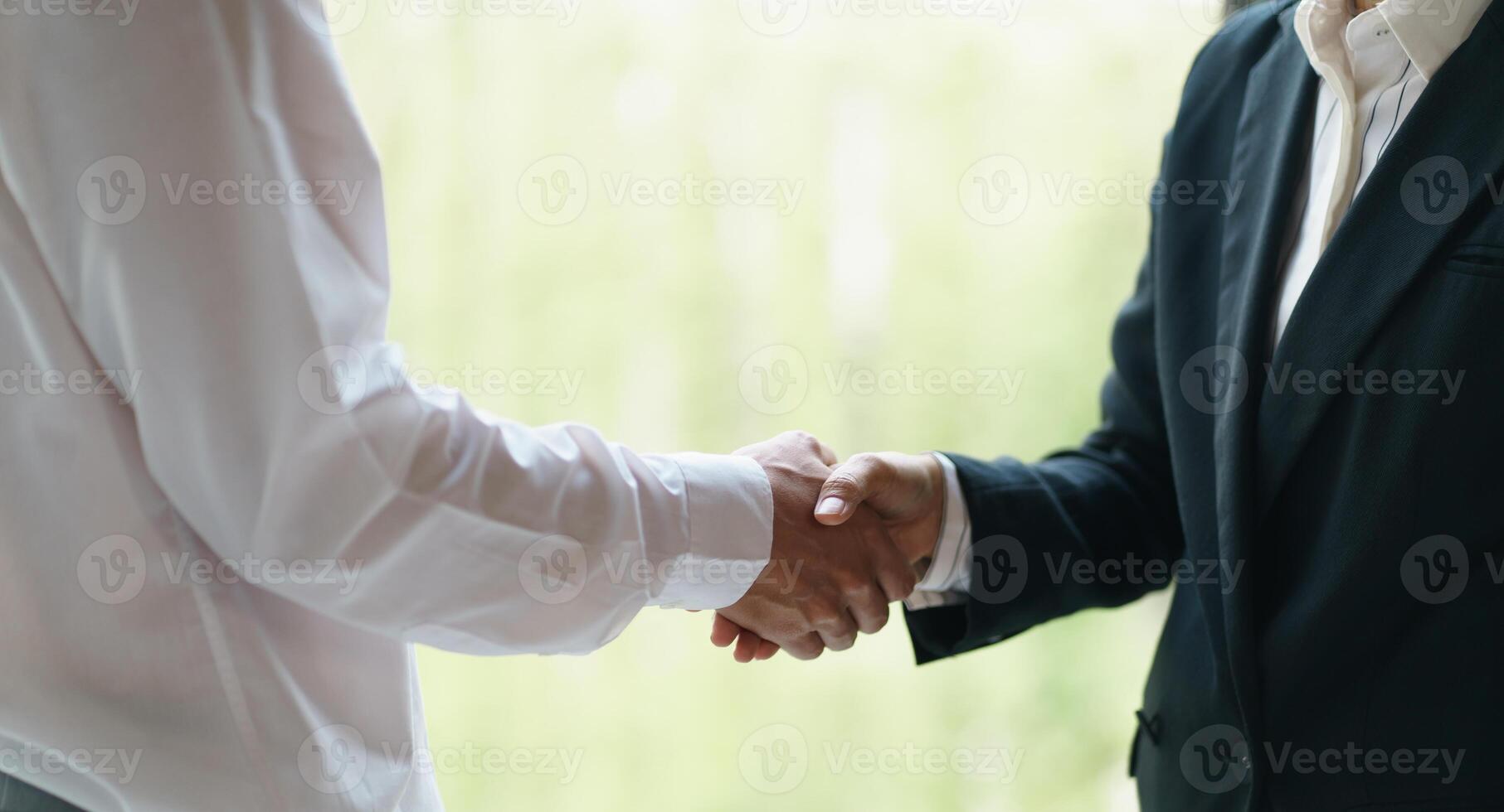 Businessman shaking hands successful making a deal. mans handshake. Business partnership meeting concept photo