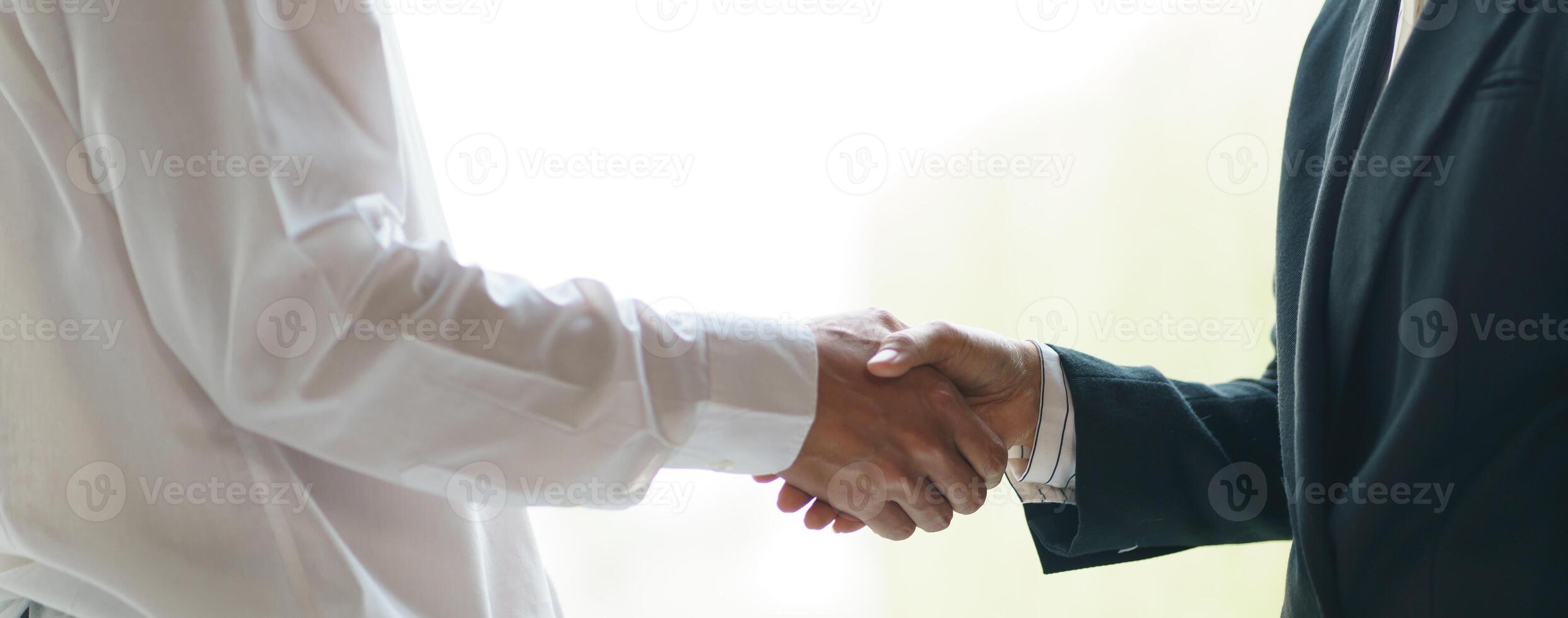 Businessman shaking hands successful making a deal. mans handshake. Business partnership meeting concept photo