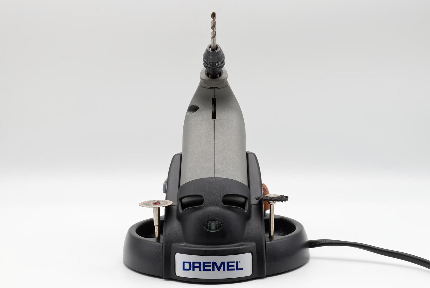 Bologna Italy March 6, 2024 Dremel Stylus Lithium-ion drill on recharger base. Front view photo