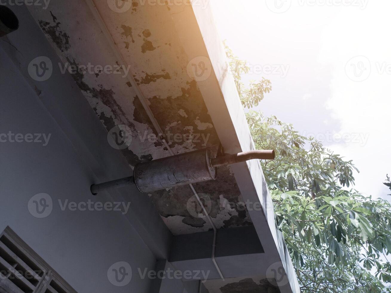Exhaust system and muffler on a engine building room. Isolated on the rooftop building power engine room, the concept of carbon gas and emissions. photo