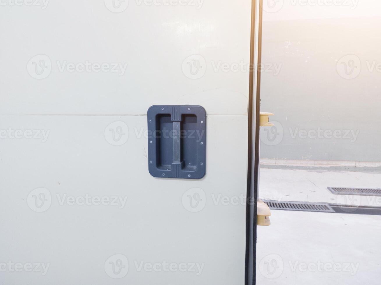 Close up handle the sliding door. Modern interior sliding door on the industrial room corridor. building factory corridor room. photo