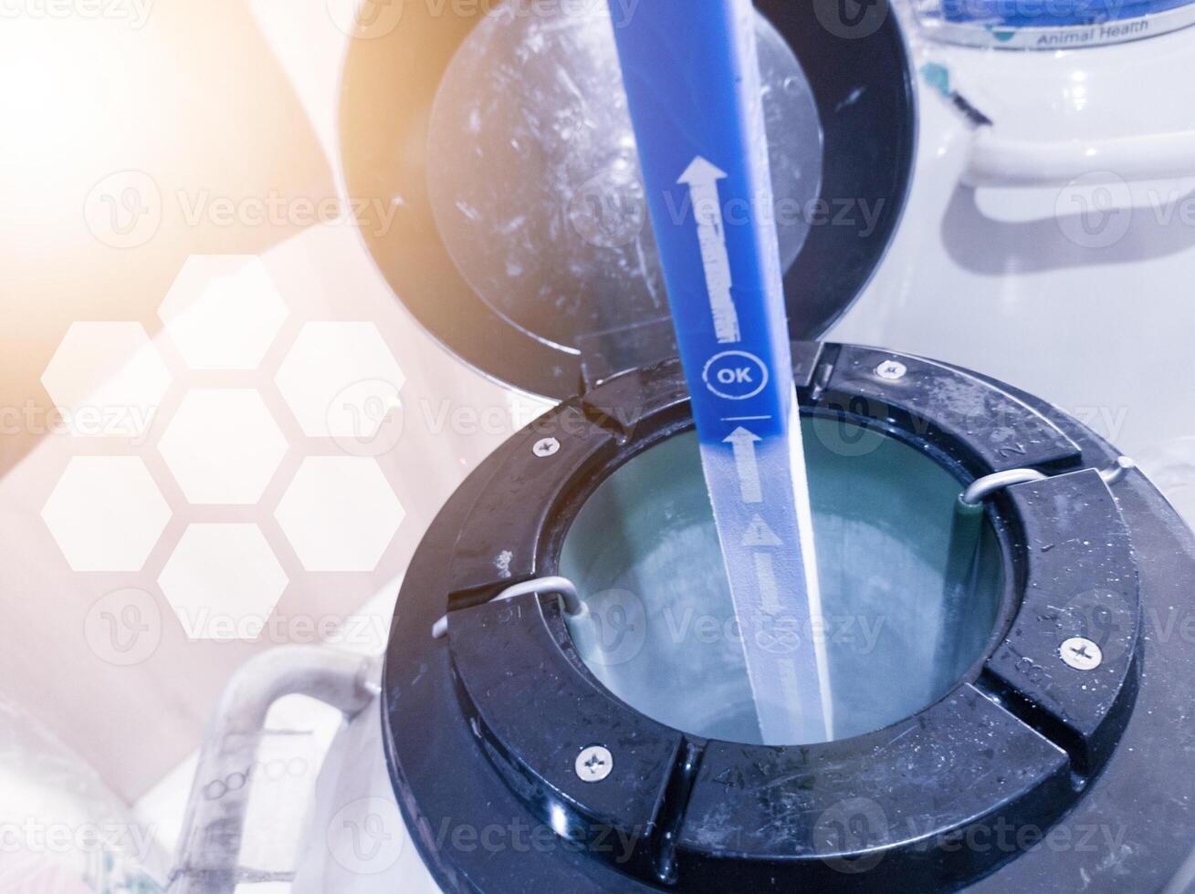 Check and measuring the Level of Liquid Nitrogen biological in container. photo