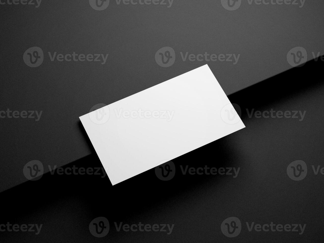 Business card on black background photo