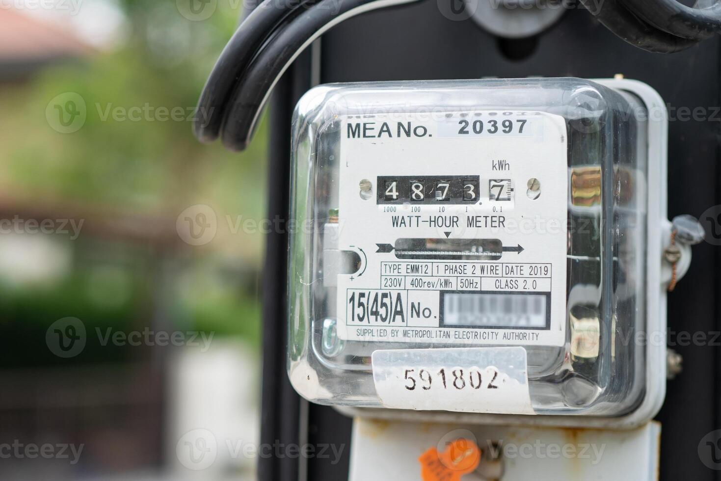 Electric measuring power meter for energy cost at home and office. photo