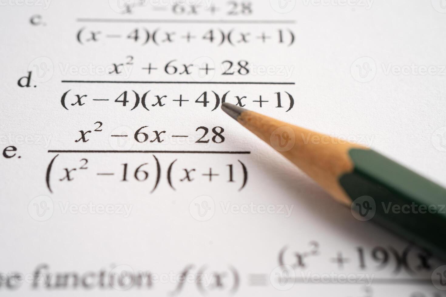 Pencil on mathematic formula exercise test paper in education school. photo