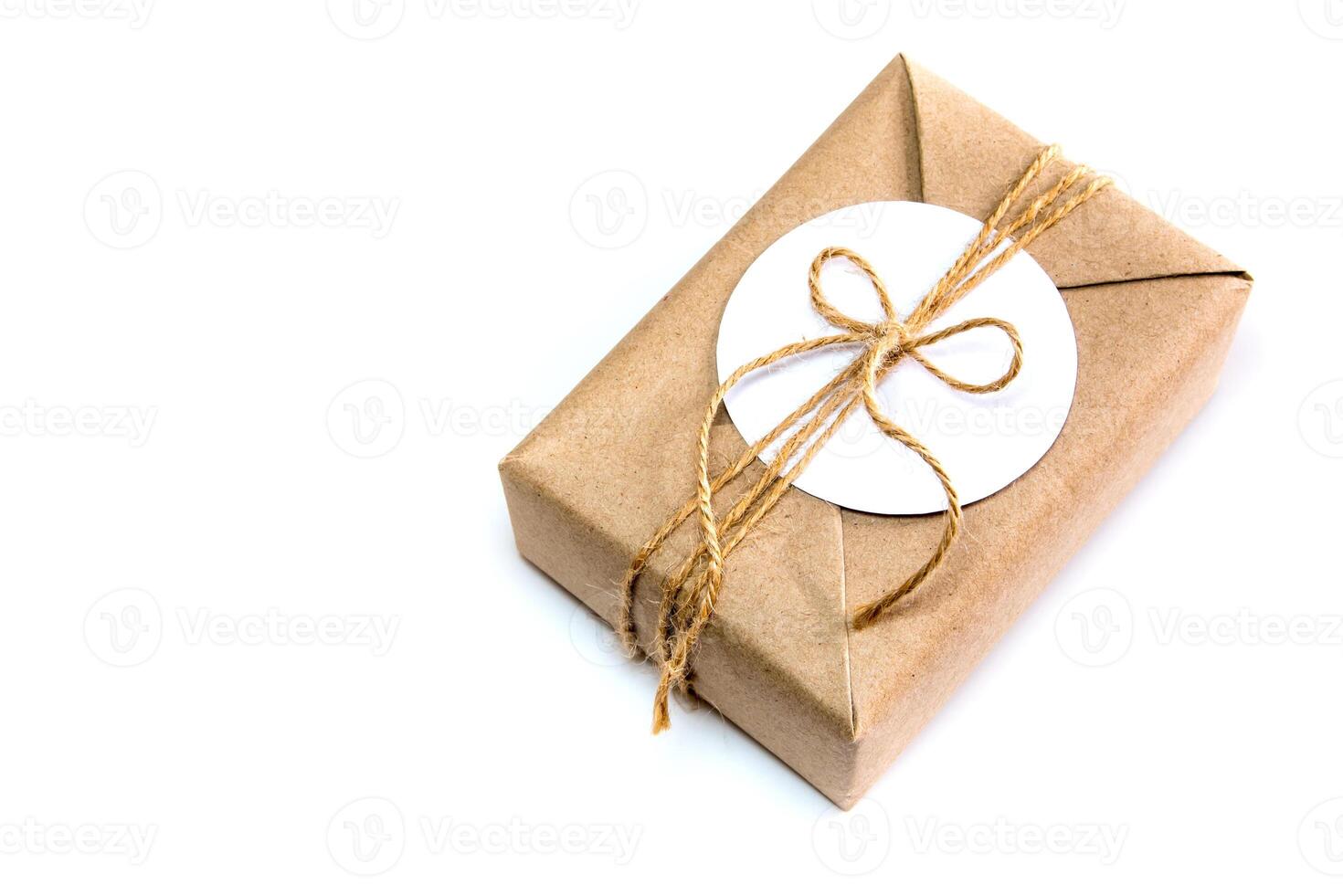 Gift box wrapped in kraft paper and rustic hemp as natural rustic style photo