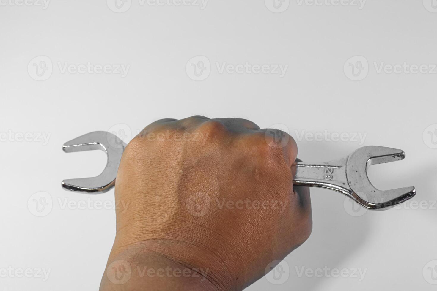 hand hold Spanner Isolated on white background photo