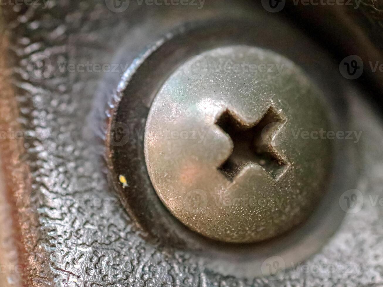 screw head in dark room with shadow light photo