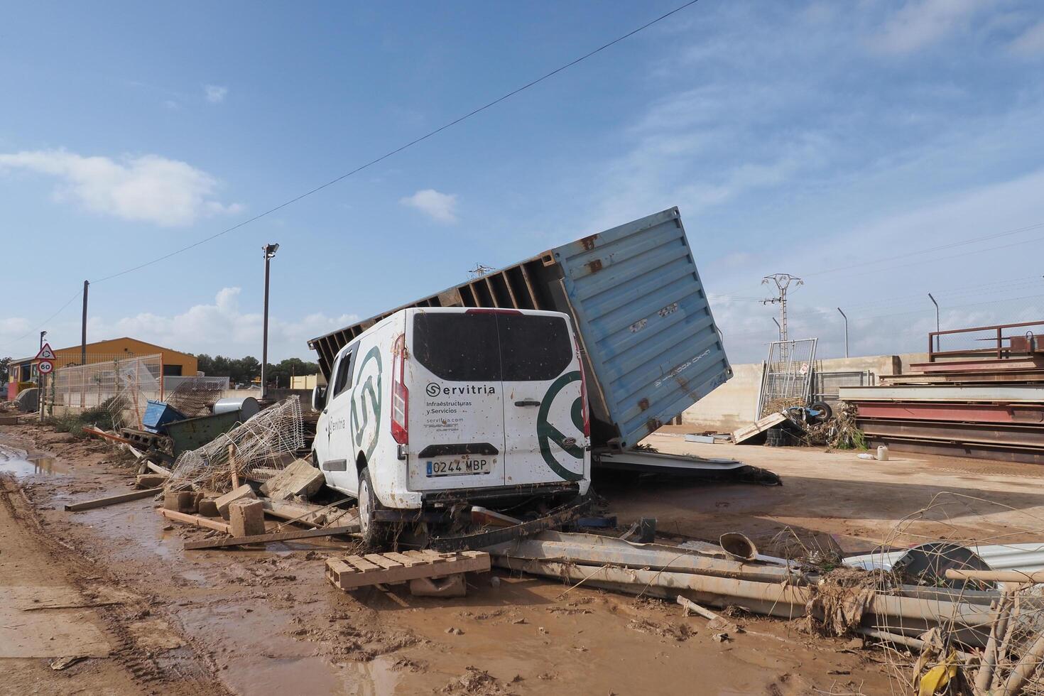 VALENCIA, SPAIN OCTOBER 31, 2024. Devastating consequences of flooding showing overturned truck and van in Valencia, Spain photo