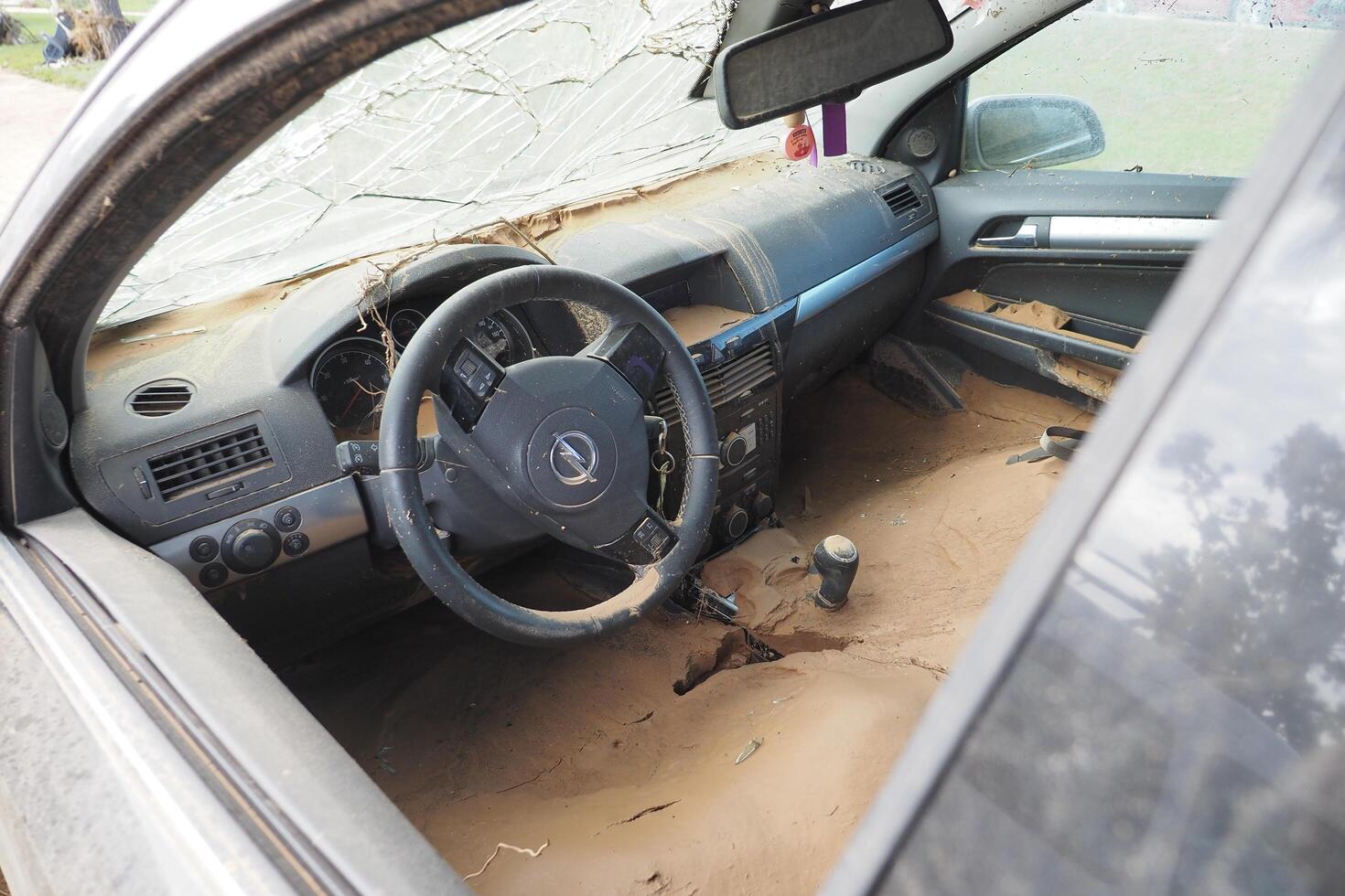 VALENCIA, SPAIN OCTOBER 31, 2024. Mud filled interior of a car showing the devastating aftermath of flooding in Valencia photo