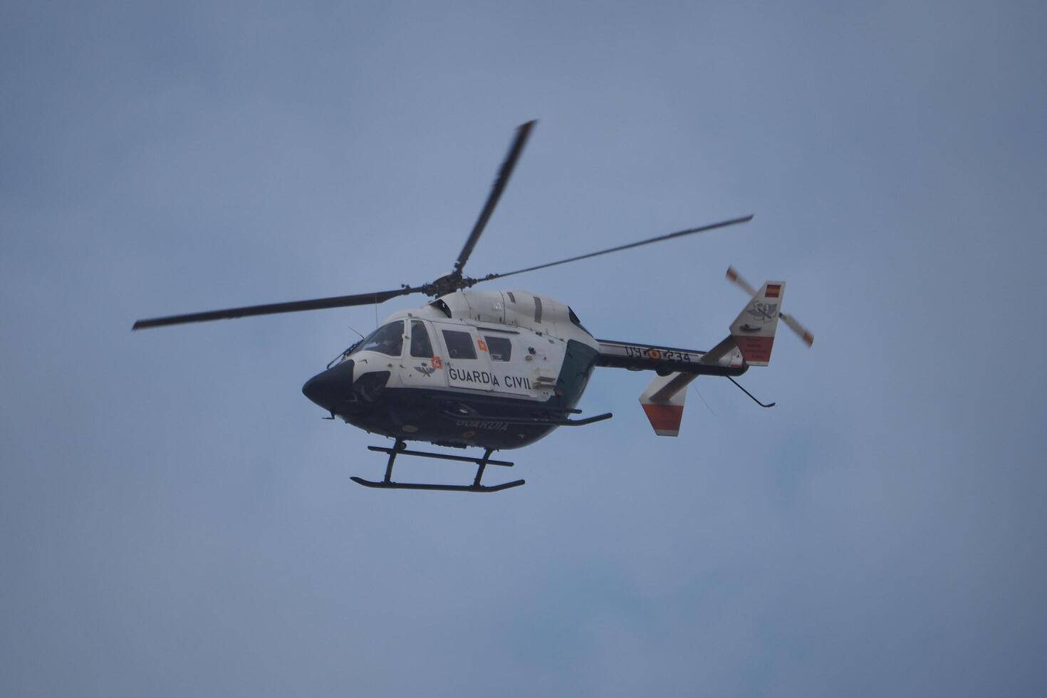 VALENCIA, SPAIN OCTOBER 31, 2024. Rescue helicopter flying over Valencia after heavy rains and floods photo