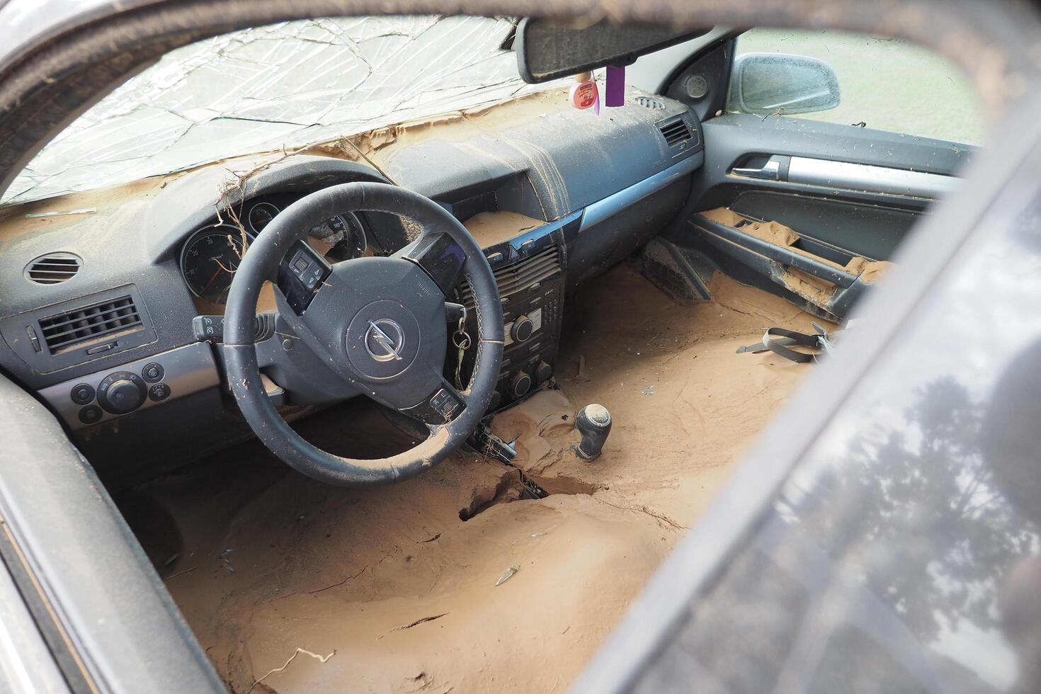 VALENCIA, SPAIN OCTOBER 31, 2024. Mud filled car interior showing the devastating aftermath of flooding in Valencia photo