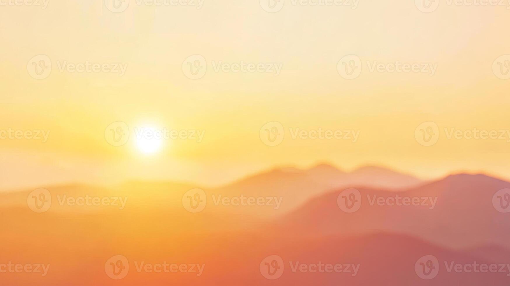 A serene sunset over a mountain range, with soft, warm tones and an expansive sky, perfect for nature and travel themes photo