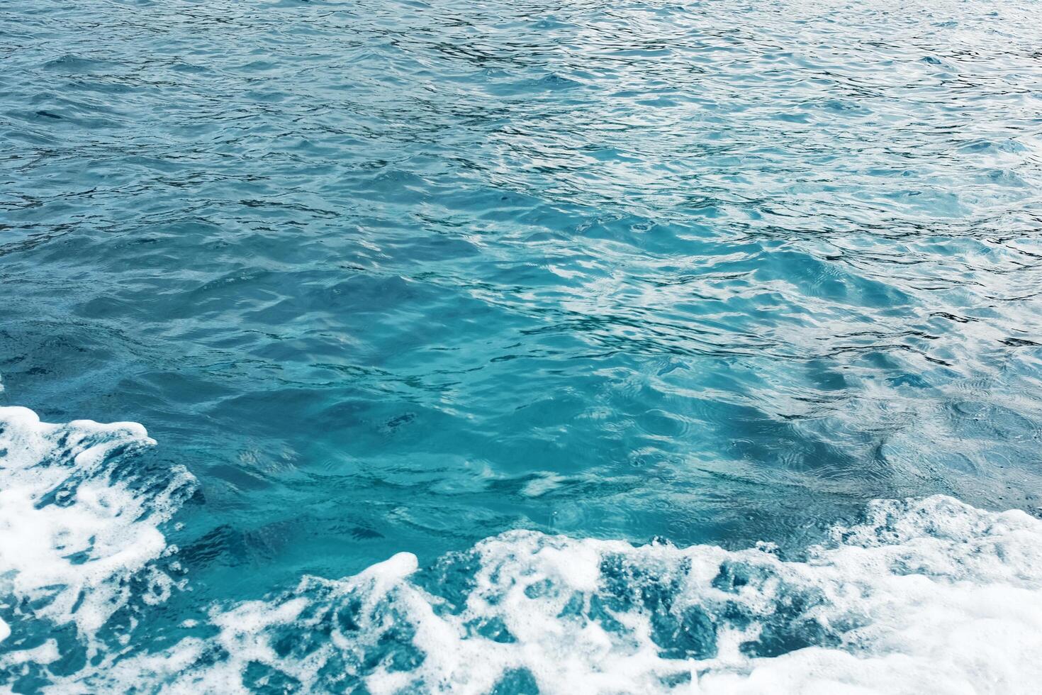 sea foam waves and splash water background and destination travel summer ocean photo