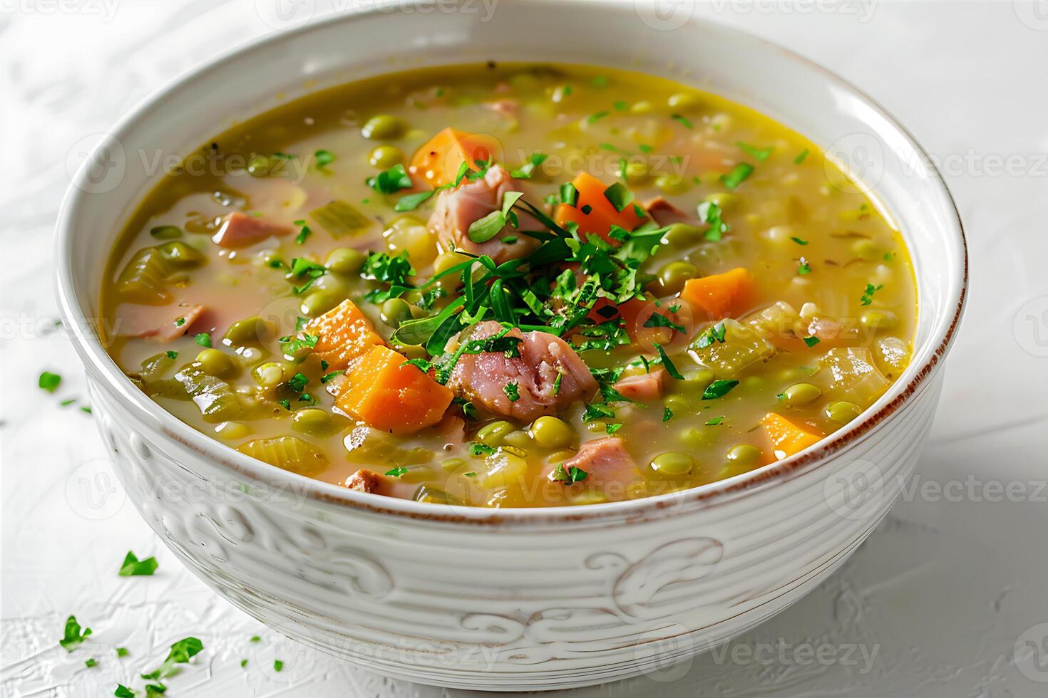 Ham hock split pea and mint stew soup in a white bowl photo