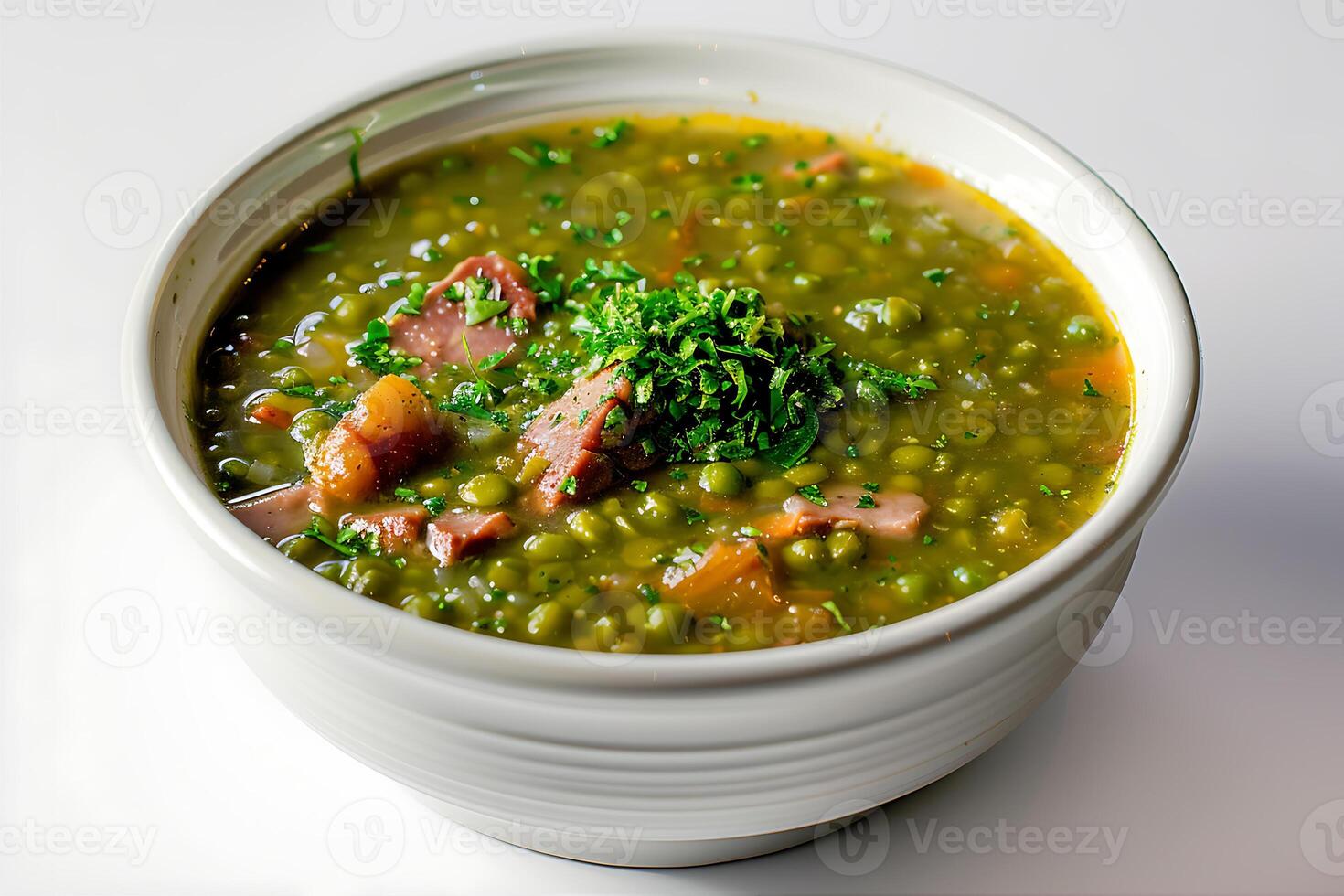 Ham hock split pea and mint stew soup in a white bowl photo