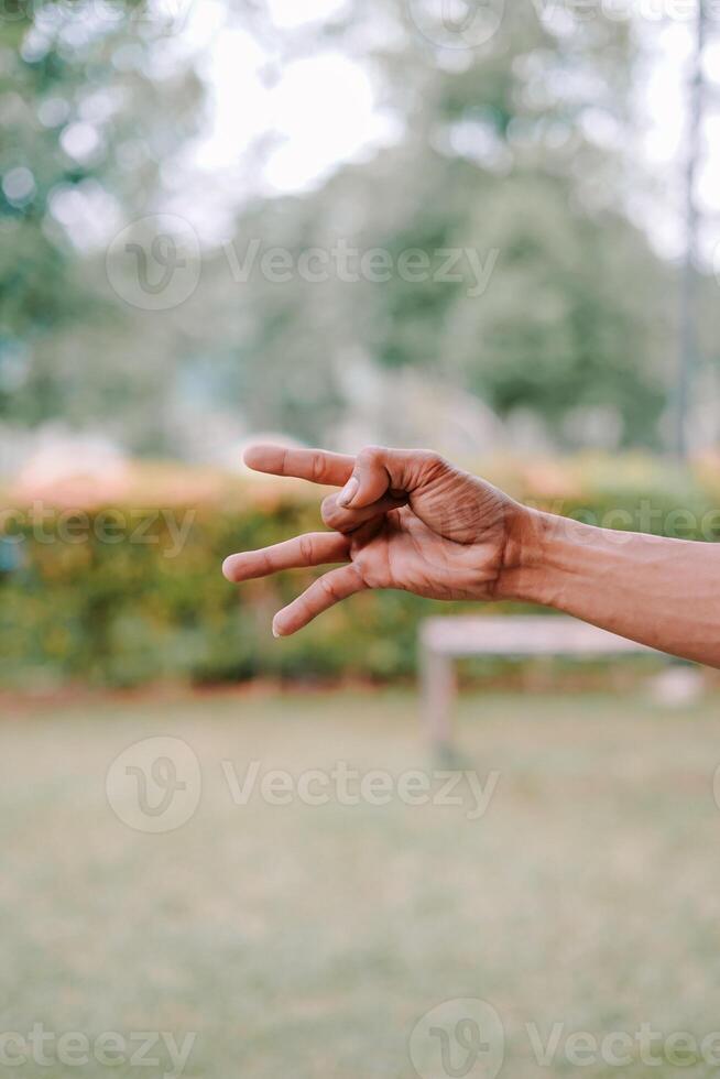 hand fingers displaying various symbols and number or gestures photo