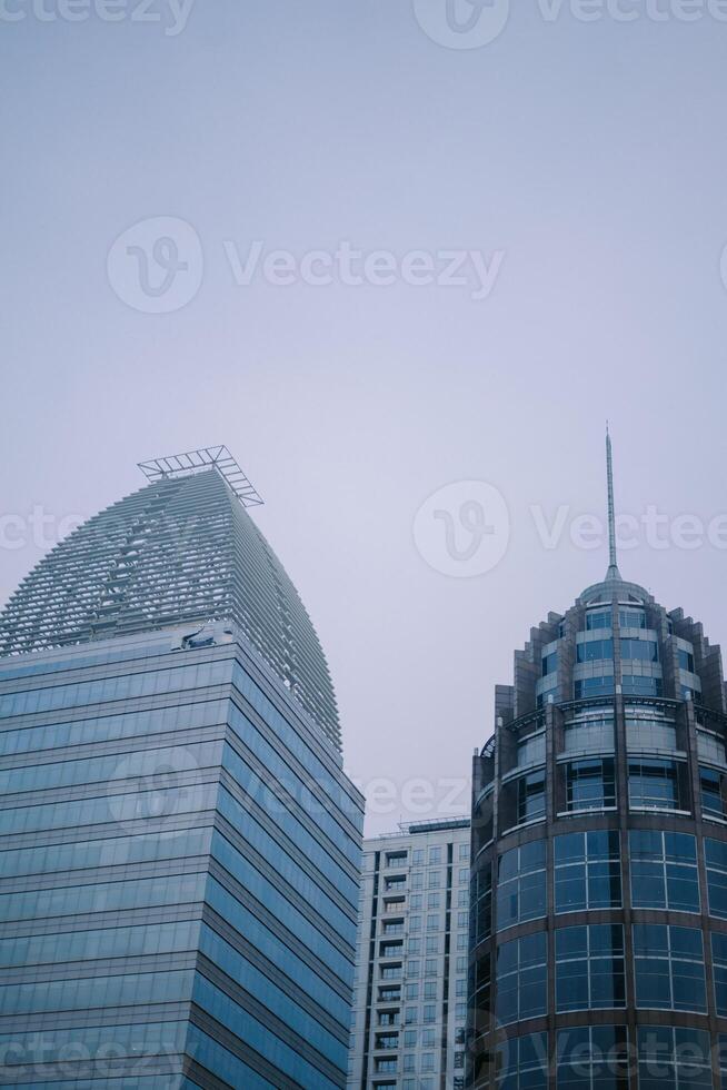 Jakarta skyline with towering skyscrapers under a bright sky photo