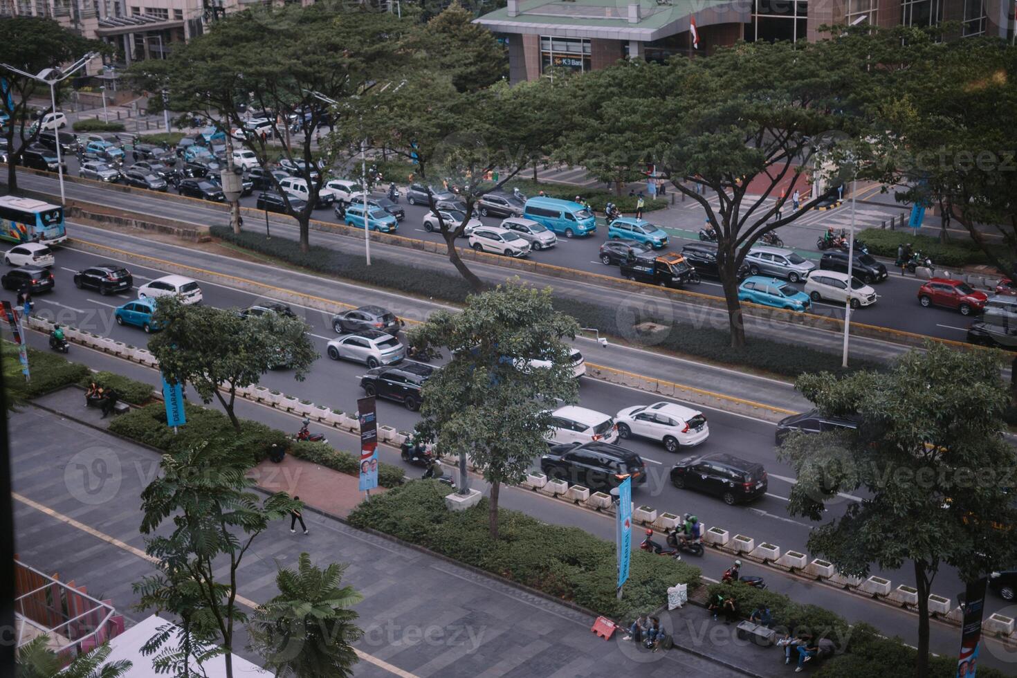 Jakarta, November 1, 2024. A bustling Jakarta street corner during midday photo