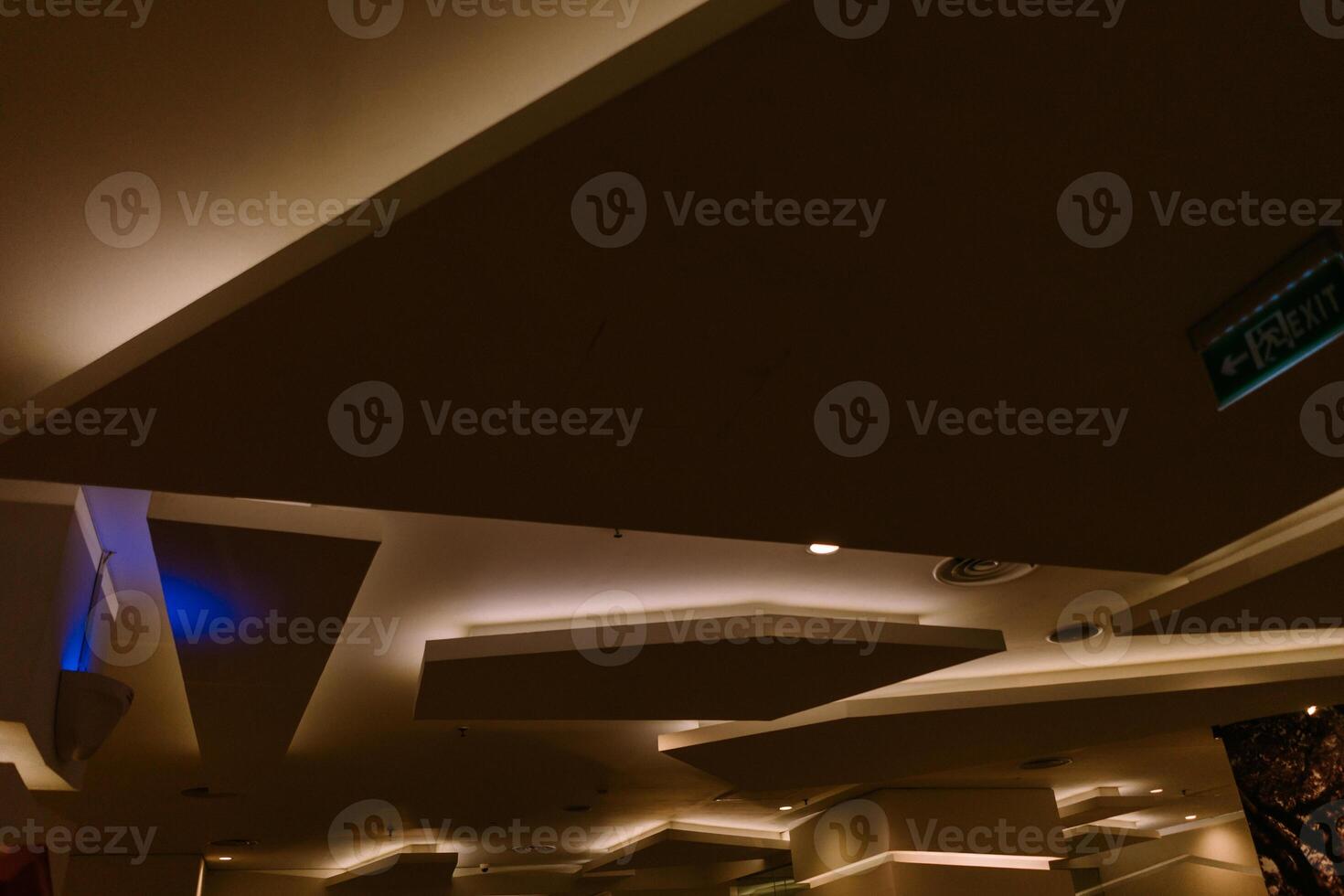 Elegant and luxurious hotel ceiling with intricate design and soft lighting, photo