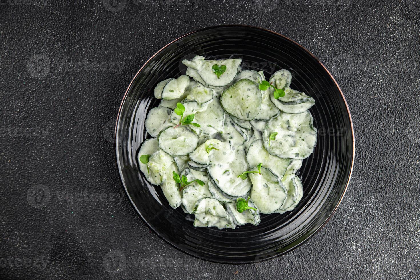 Cucumber salad fresh cream tasty food dish fresh delicious gourmet food background on the table photo