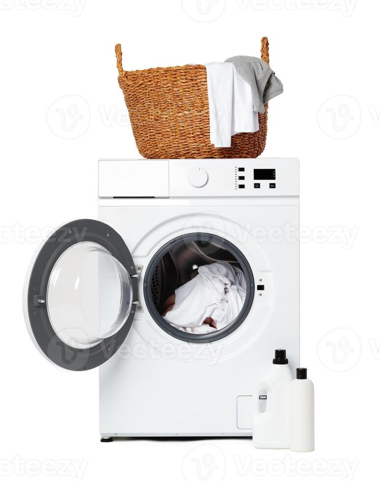 White Front Load Washing Machine With Clothes Inside and Laundry Detergent photo