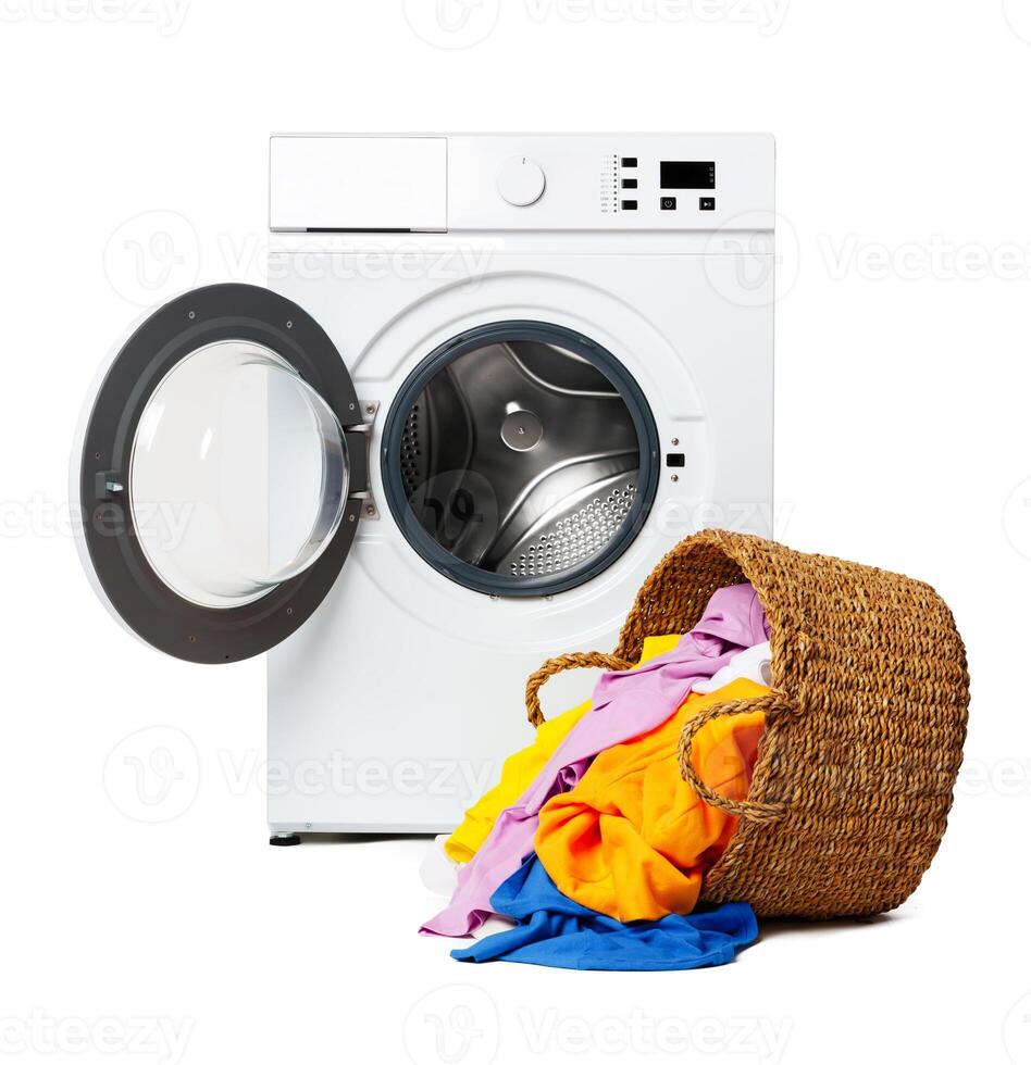 White Washing Machine With Open Door and Clothes Overflowing From a Wicker Basket photo